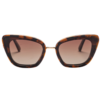 Tortoise cat eye sunglasses with polarized brown lenses and a gold nose bridge, highlighting their unique angular design.