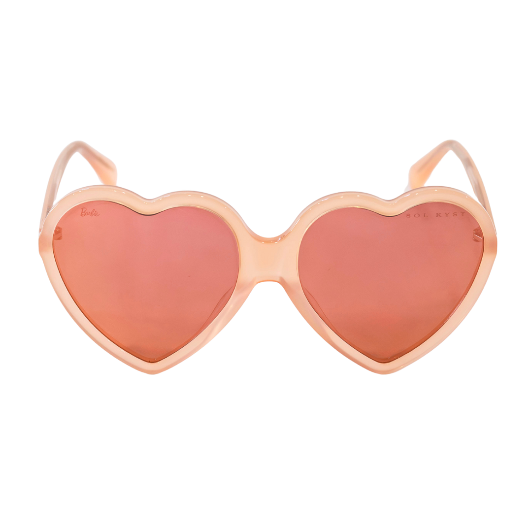 Peach-pink heart-shaped sunglasses with nylon lenses from the Barbie x Sol Kyst collection.