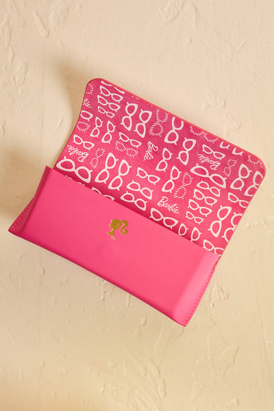 Pink Barbie sunglasses case open, showing interior design - top view