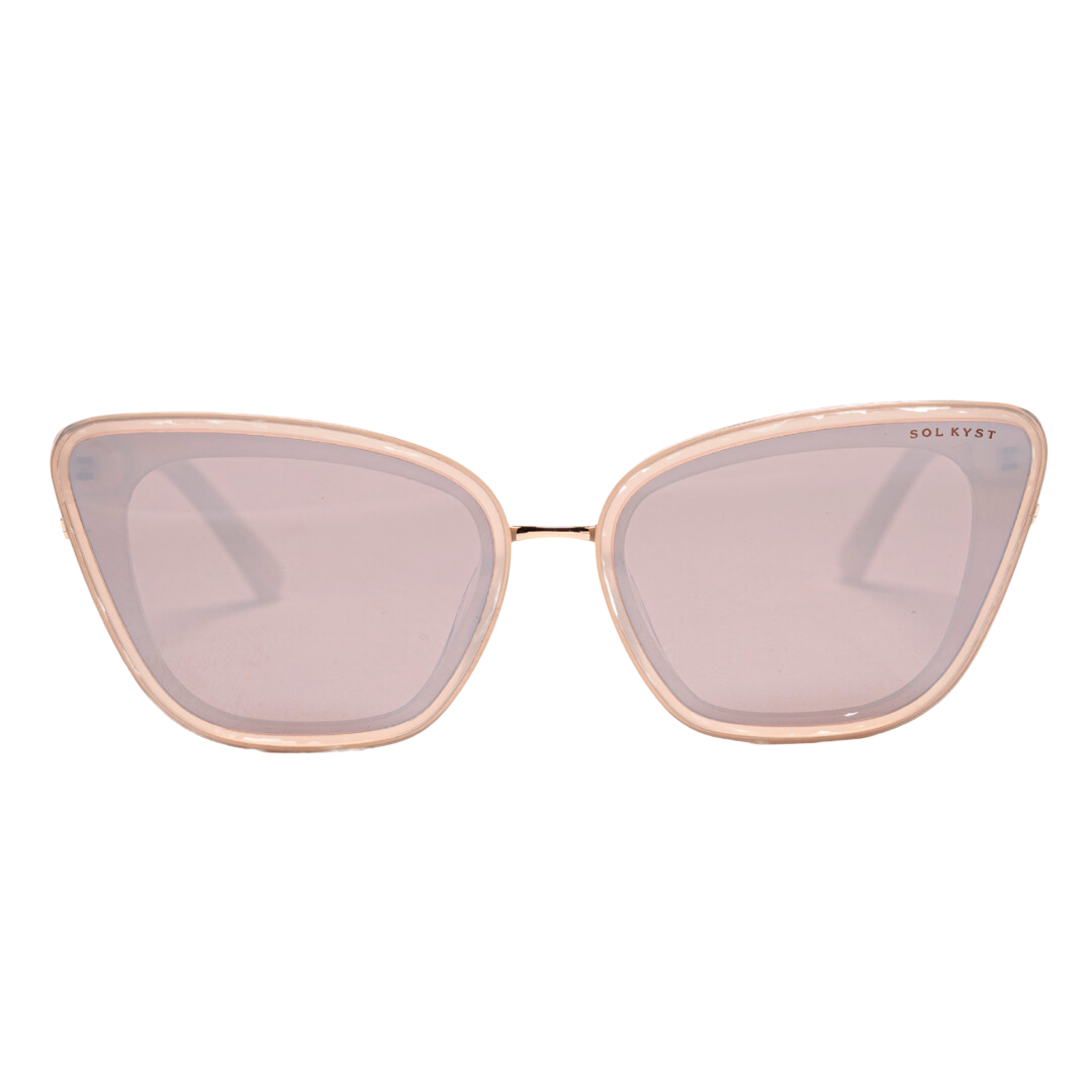 Beige Sol Kyst women's cat eye sunglasses featuring light pink-tinted lenses, shown in a front view.